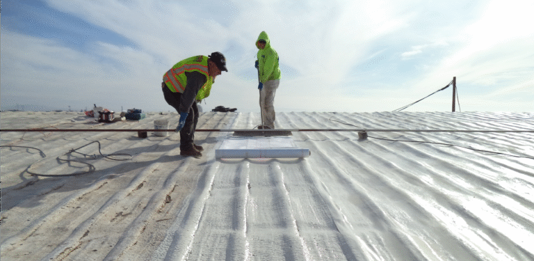 Reflective roof coating being applied to a flat roof in Florida
